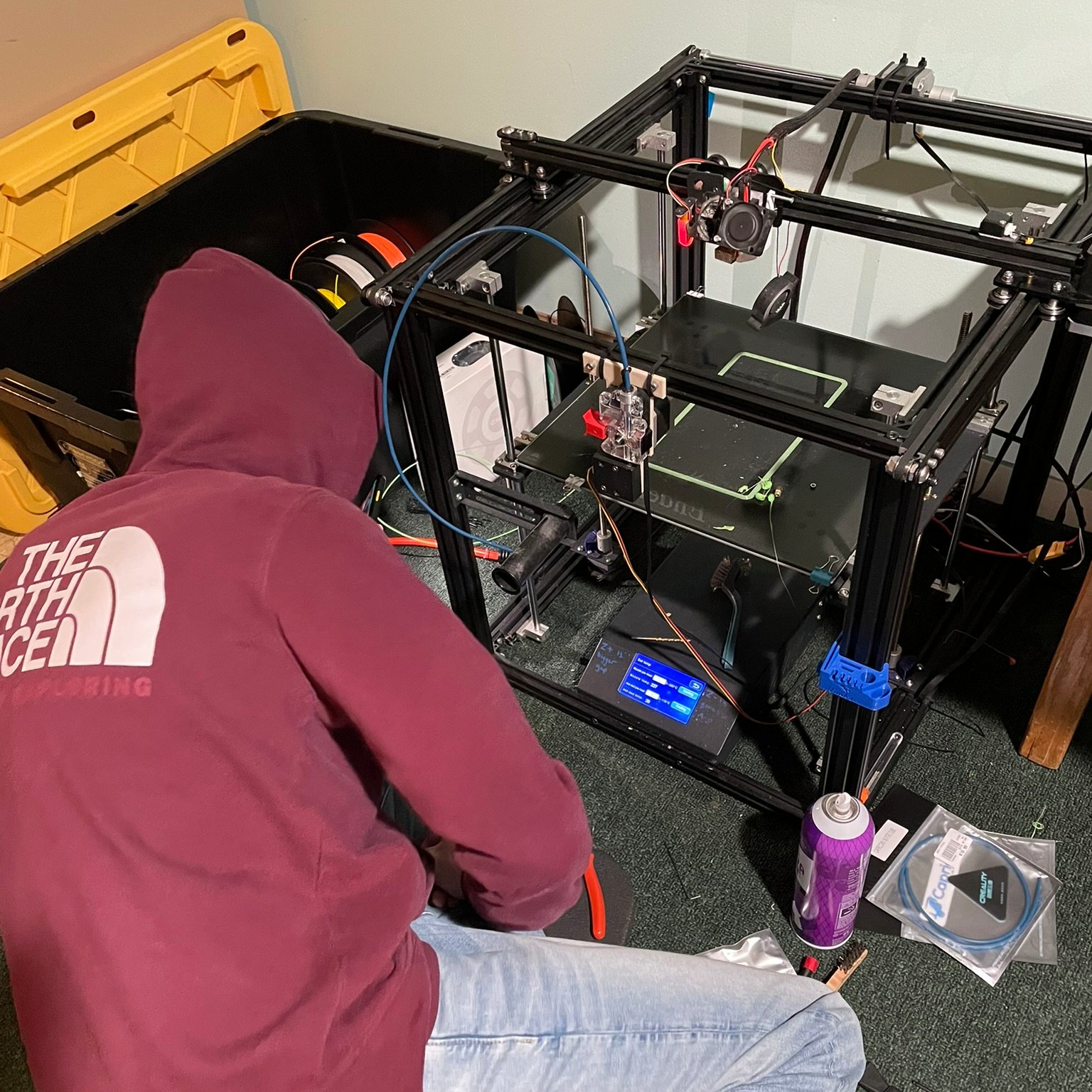 Michael maintaining the Ender 5 Plus — the printer that started Pontiac Printing Press